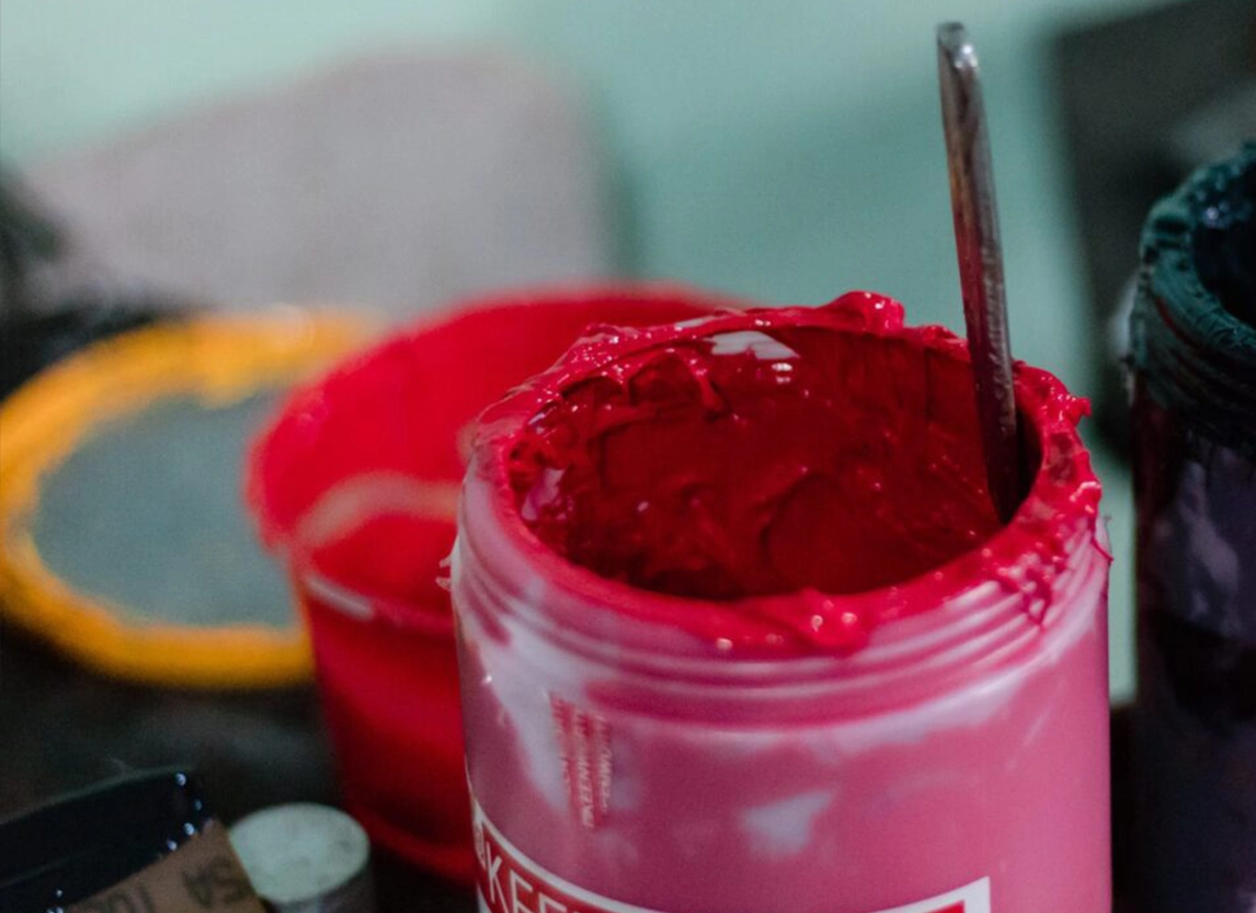 Dose up of red screen printing ink used for custom t-shirt printing in Miami